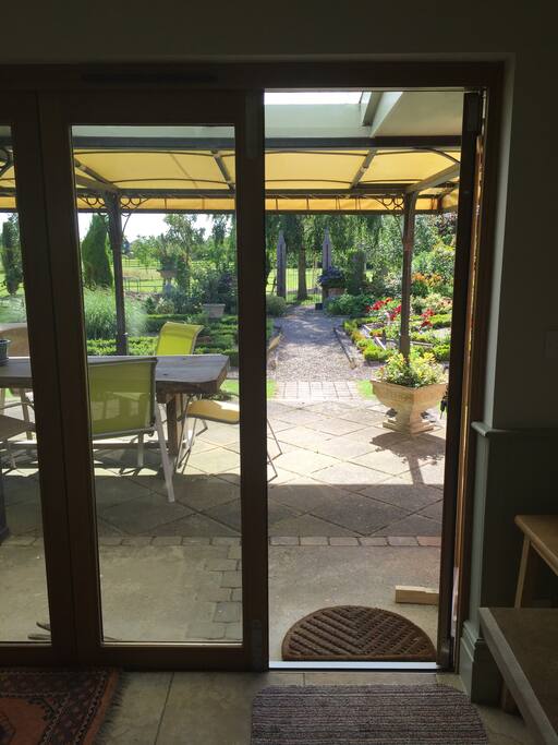 Leading from conservatory to garden