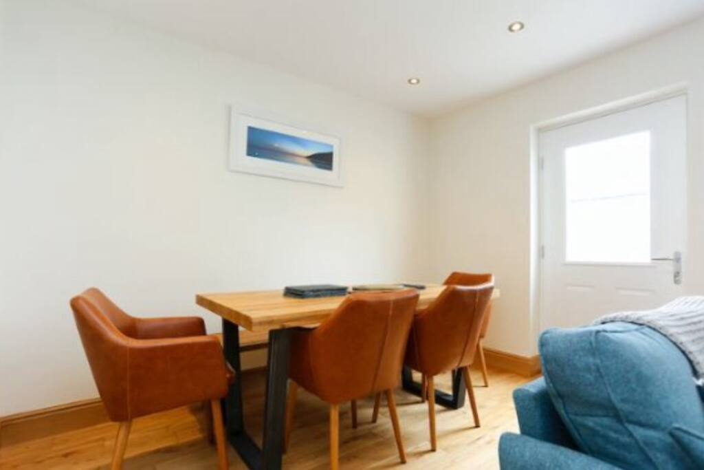 Dining table with seating for 6/7 people. Bench on the other side. High chair and children's crockery provided.