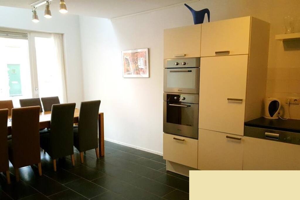 Kitchen with dining table for 8 persons.