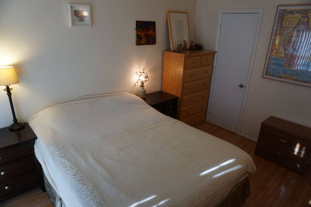 Bedroom 1 with large bed and dresser