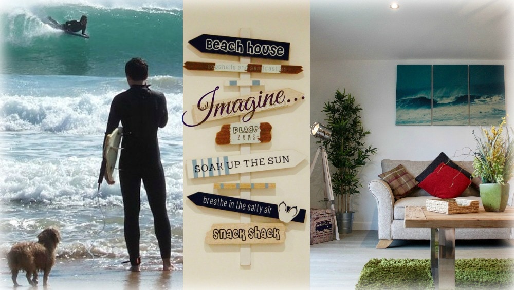 A surfer is captured riding a wave, while a small dog plays in the shallow water nearby. The image is complemented by a wooden signpost featuring various beach-themed directives. A cozy living area is also visible, displaying comfortable seating and beach-inspired artwork.