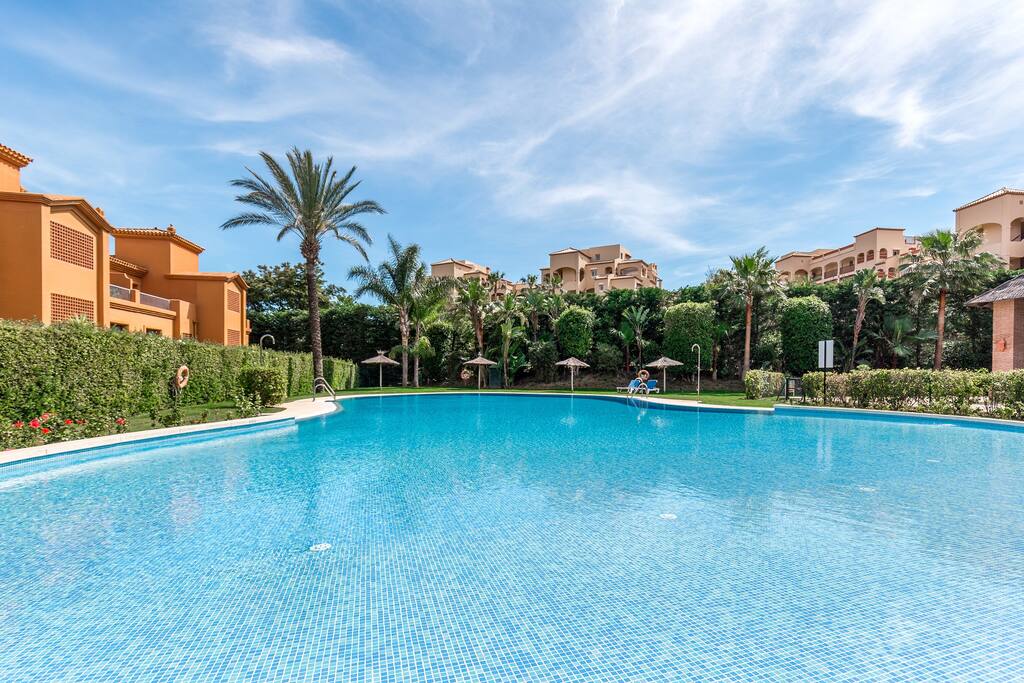 Large outdoor pool with sun loungers
