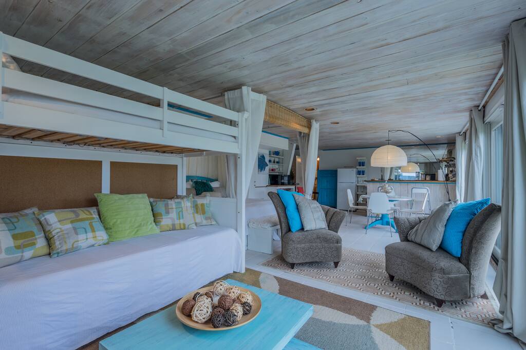 View of the sofas/bunkbeds and seating area for TV viewing/hanging out.