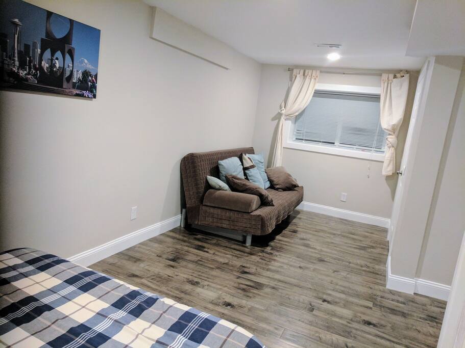 Larger bedroom. The brown futon folds down and can sleep one person or a couple.