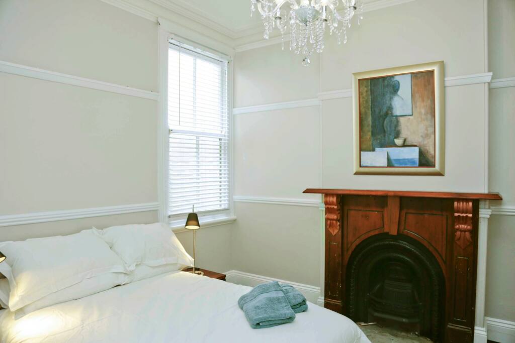 Bedroom with original restored fireplace