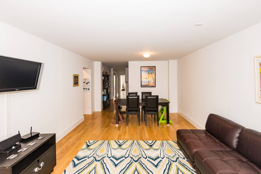 Big table in the living room comfortably sits 6 adults.