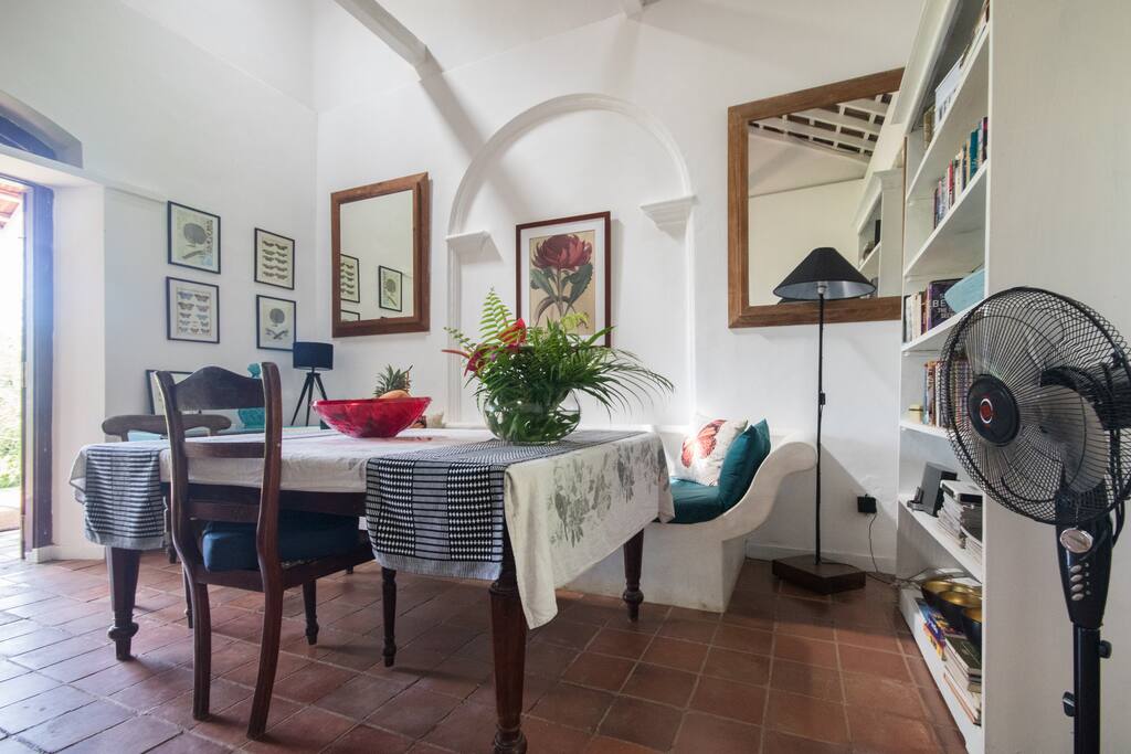Welcoming multi use internal dining and lounge area complete with well stocked bookcase #dining #library