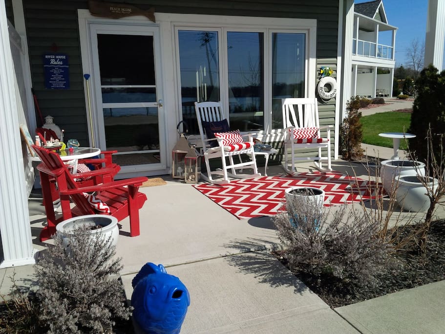 This beautiful covered porch looks at the river and is perfect for morning coffee or a glass of wine to watch the amazing sunsets over the St. Clair River