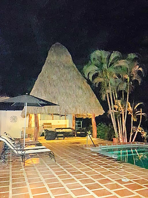 Night view of common/palapa/pool/patio area
