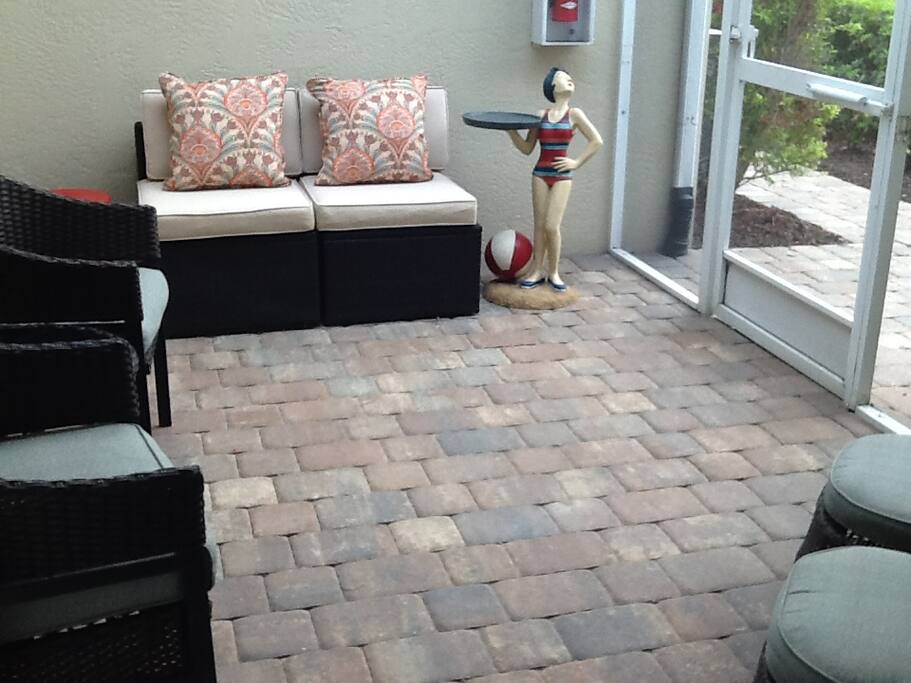 Enjoy your morning cup of coffee in the screened-in front porch.