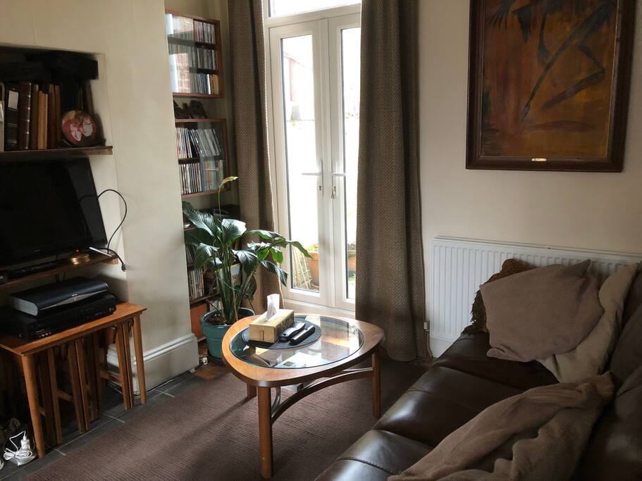 Comfy leather sofa in lounge and sky TV