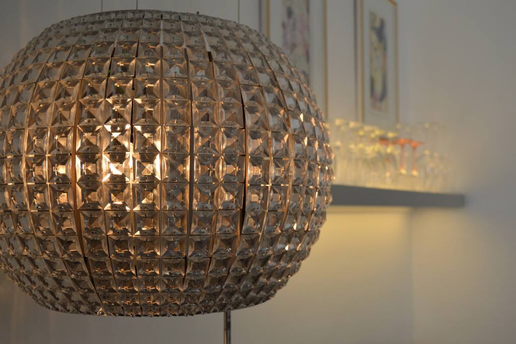 Designer features like this beautiful chandelier stove hood