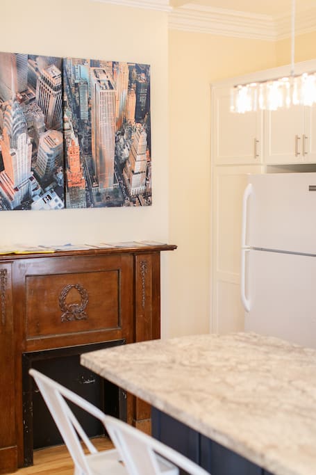Artwork and Mantle in Kitchen
