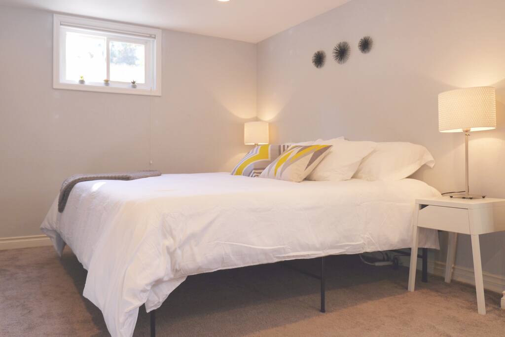 King sized bed with fluffy white linens!