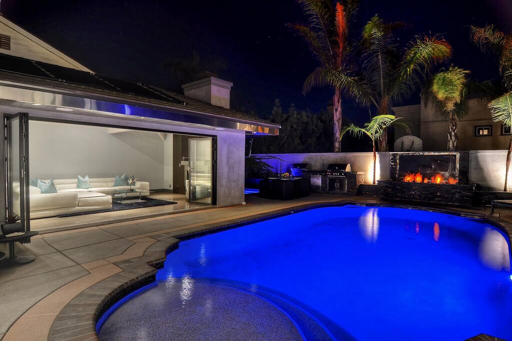Living room, dining room, and master bedroom all open onto the pool patio.