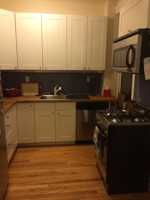Kitchen with gas range and stove, microwave, toaster, refrigerator, dishwasher, SodaStream, Magic Bullet & plenty of counter space.