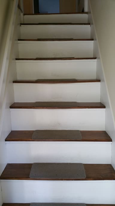 Steep, pre-code stairs lead to the room