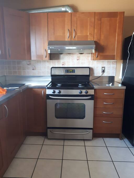 A spacious kitchen with natural gas oven and dishwasher but we prefer manual washing.