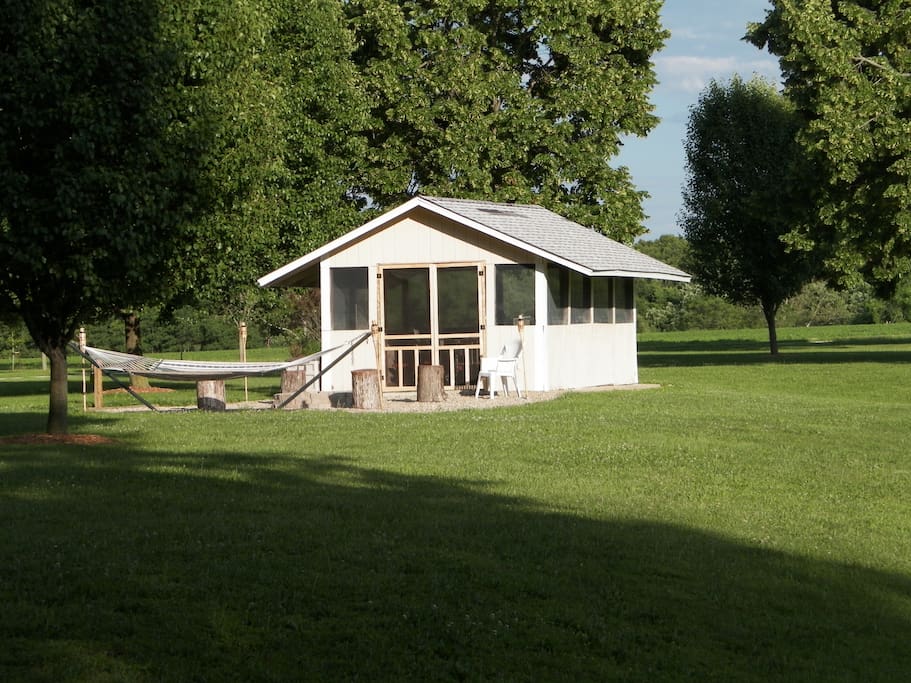 Relax at the fire pit or in the private shelter by the pond