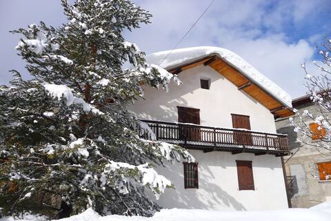 Village house between river and mountain