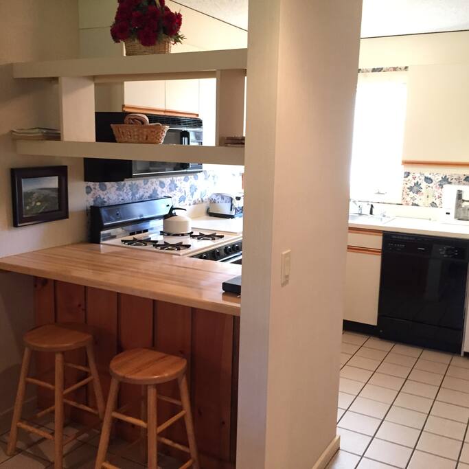Open pass through kitchen with breakfast bar