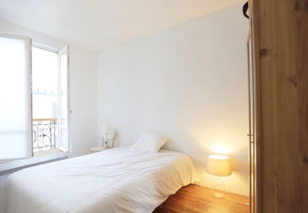 The bedroom has a double bed, a desk and a wardrobe, the window is on an inside courtyard and very quiet