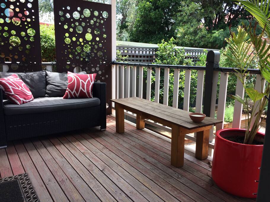 Back deck overlooking rear courtyard. Perfect spot to catch the afternoon breeze!