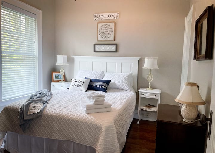 Guest Bedroom #2 with a queen bed, armoire, T.V with privacy and bright light.  Makes one feel at home and relaxed.