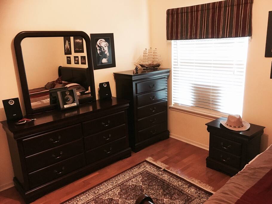 All side table drawers, dresser drawers, chest of drawers are empty for any guest(s) to use. The room has a radio as well as a stainless steel mini-fridge.