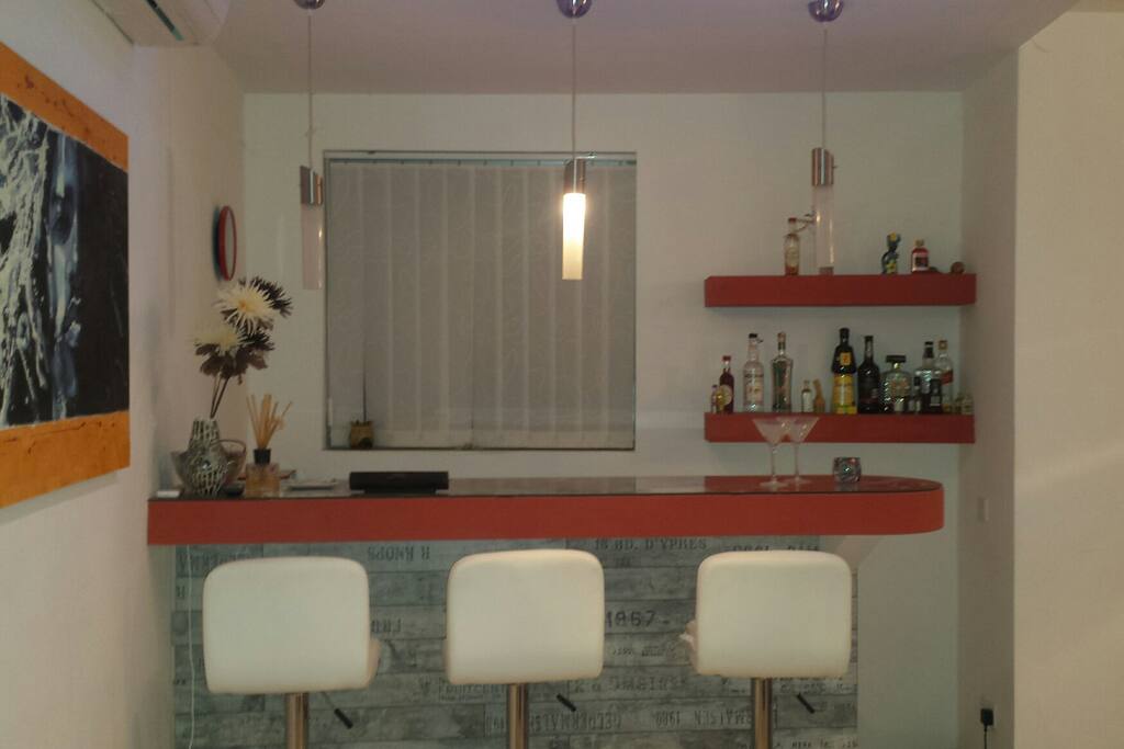 Bar area in open space next to living / dining area
