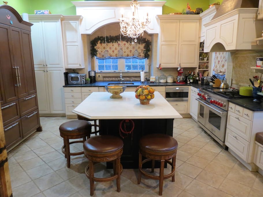 Gourmet kitchen with SubZero fridge and 6-burner Wolf range and double ovens
