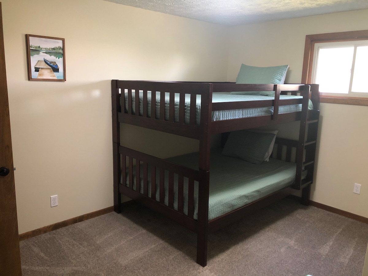 Bedroom 6 - Full over Full Bunk Beds located downstairs in the basement.   Sleeps 4, but the top bunk can only have 159lbs on it.  Has a nice closet.  This is the room with the pack and play, kids books, and jumper.  
