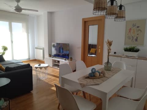 A charming apartment in a residential development with a swimming pool and golf