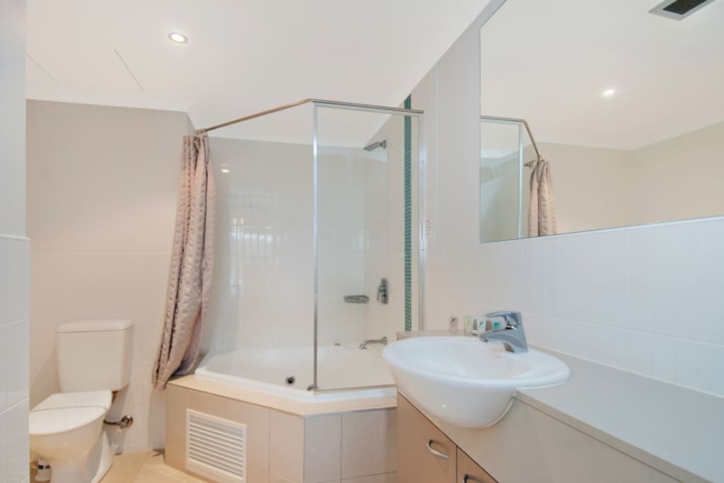 Modern bathroom with corner spa