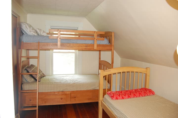 Bunk room with 3 single beds