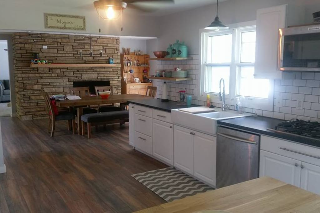 Dining room with a door that leads out to the backyard.