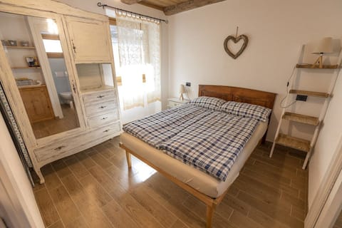 My Grandparents' House (between lake and mountains)