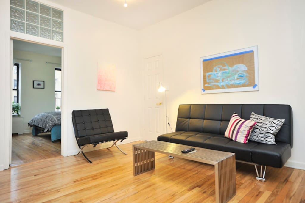 Living area; doorway to second bedroom with glass block transom