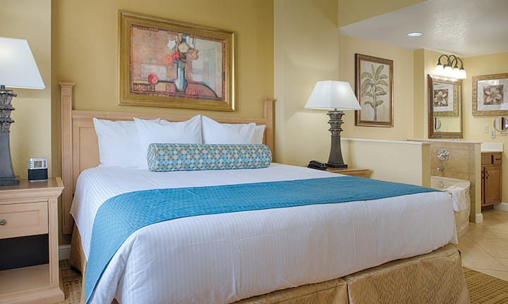 King bedroom with attached bathroom and whirlpool tub.