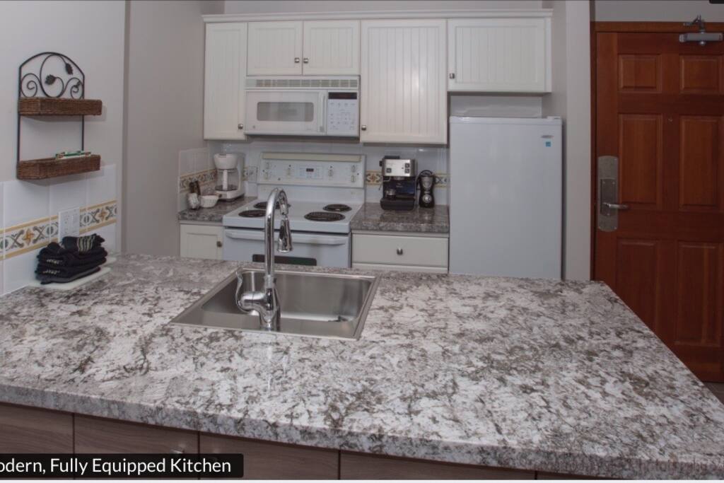 Fully equipped kitchen with granite countertops