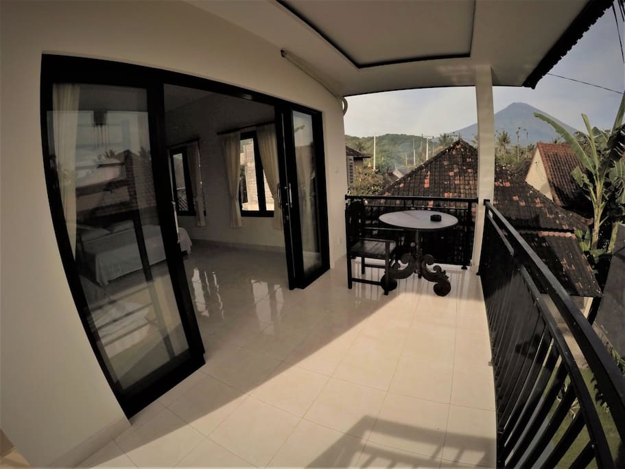 Terassa with an amazing view on the holy active volcano of bali, the Gunung Agung.
