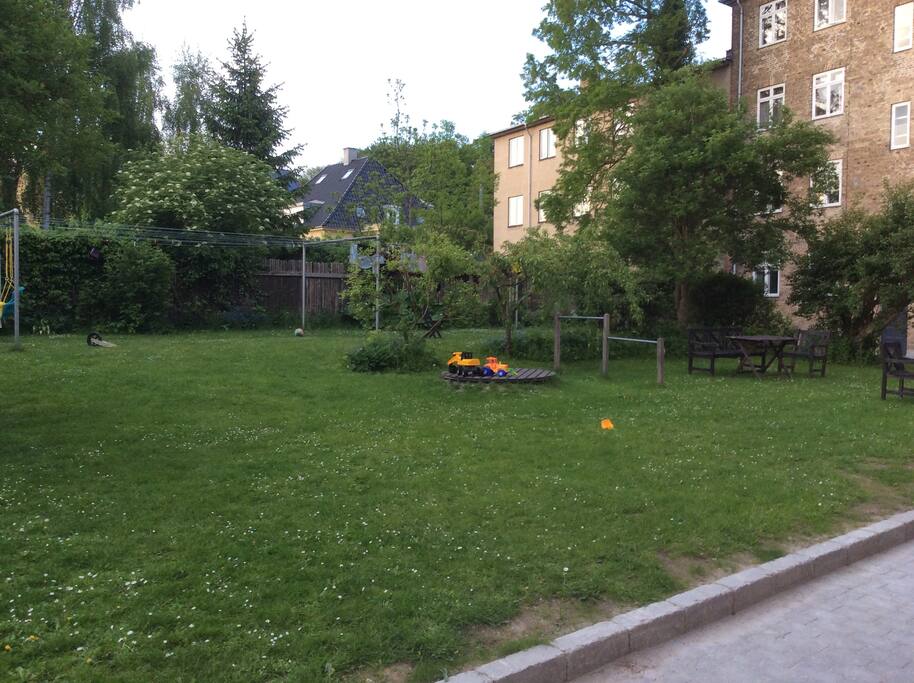 Swings, sandbox and playhouse for the kids