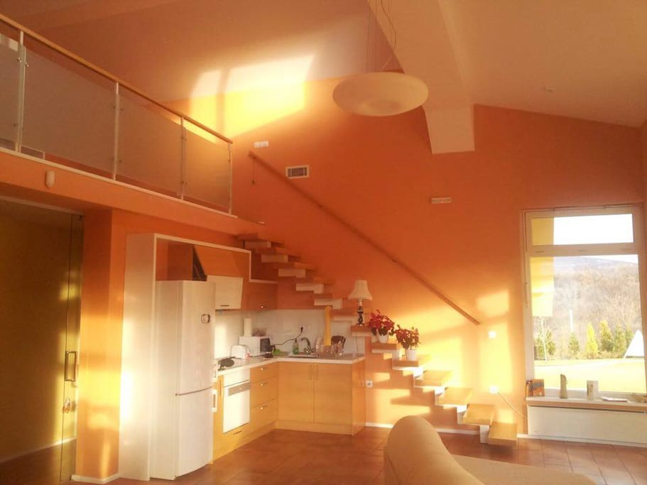 Kitchen and living room at winter time (the sun glows in the house only during the winter)