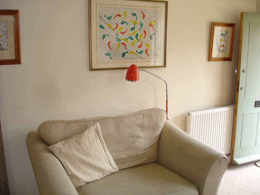 Cosy sitting room - with TV and wood burner.
