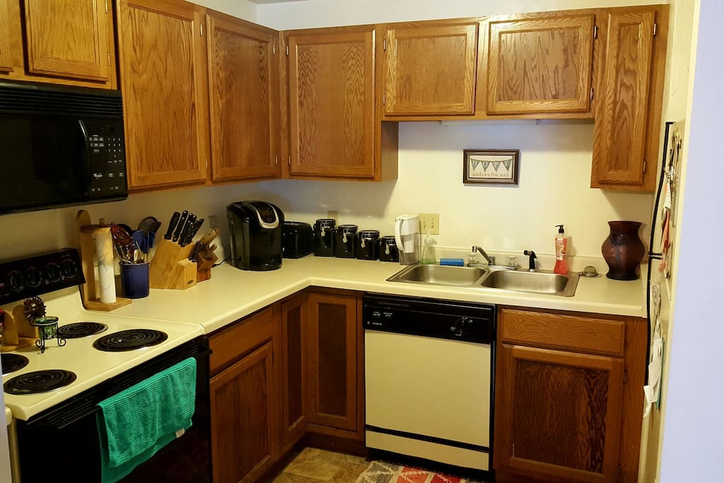 Kitchen includes dinner set, stove, microwave, dishwasher and fridge. Also, includes keurig coffee maker.