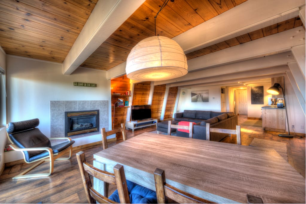 Dining table, gas fireplace, and living room