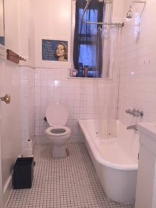 Clean, WHITE bathroom with meditation tub!