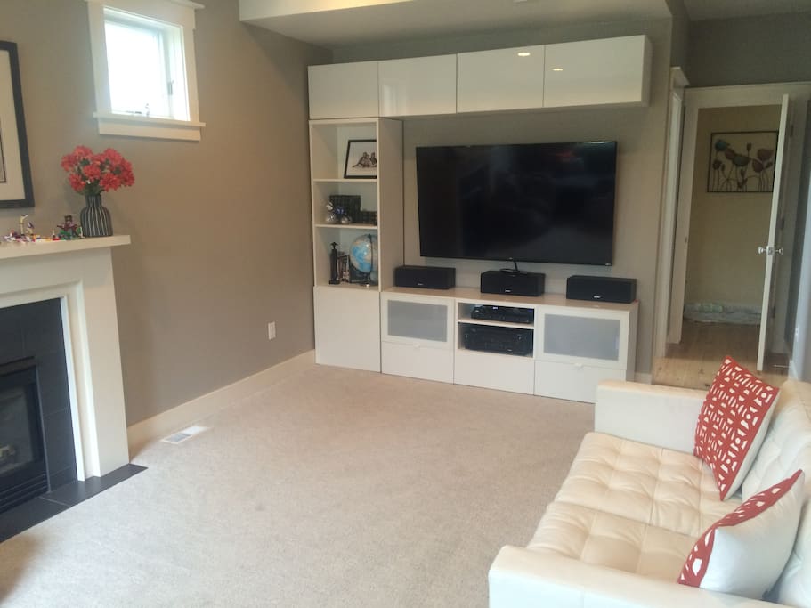 Den with big screen TV, gas fireplace