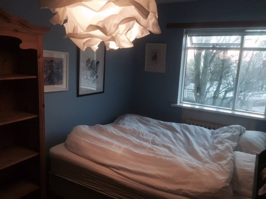 Comfortable bedroom with a big bed.