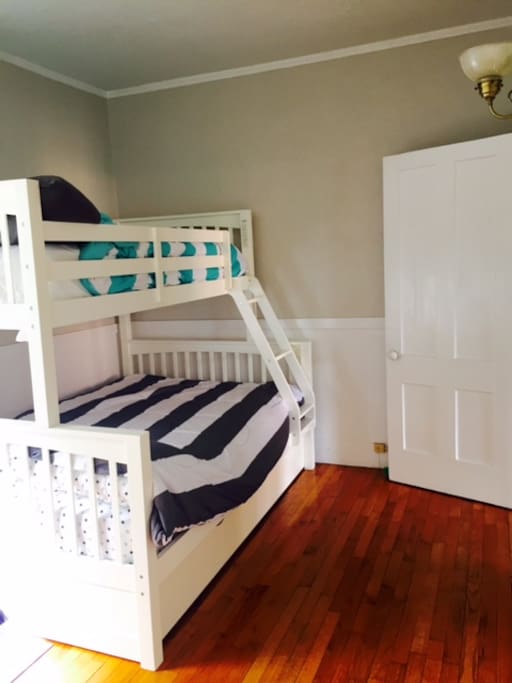 Bedroom with bunk beds (one twin and one full) plus a trundle bed.